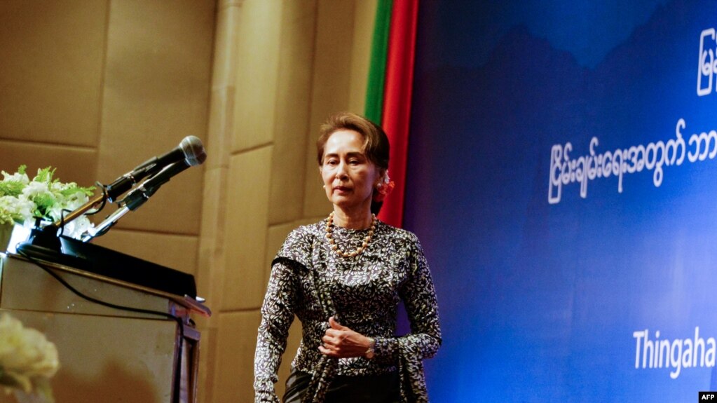 Aung San Suu Kyi takes the stage May 7 at a forum for National Reconciliation for Peace in Myanmar