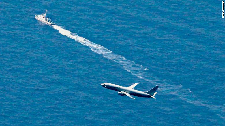 A Japan Coast Guard's vessel and US military plane search for a Japanese fighter jet, in the waters off Aomori, northern Japan, Wednesday, April 10, 2019.