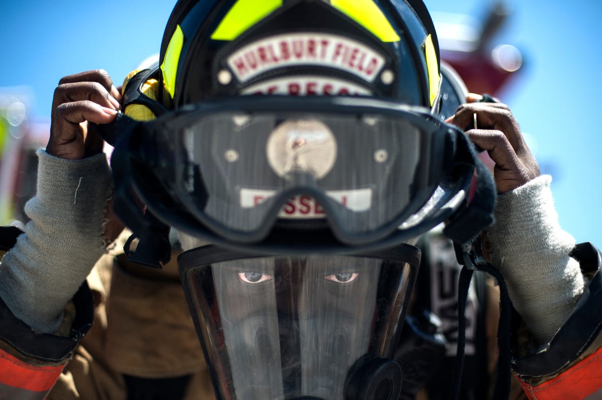 dedicated-personnel-within-the-air-force-train-to-be-firefighters-capable-of-responding-to-a-range-of-emergencies-at-a-moments-notice-here-an-airman-puts-on-his-helmet-as-part-of-training-in-ventilation-techniques.jpg