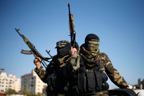 palestinians-militants-leave-after-representatives-of-various-palestinian-armed-factions-held-a-news-conference-to-condemn-the-decision-of-an-egyptian-court-that-banned-hamas-armed-wing-in-gaza-city-february-5-2015-reuterssuhaib-salem.jpg