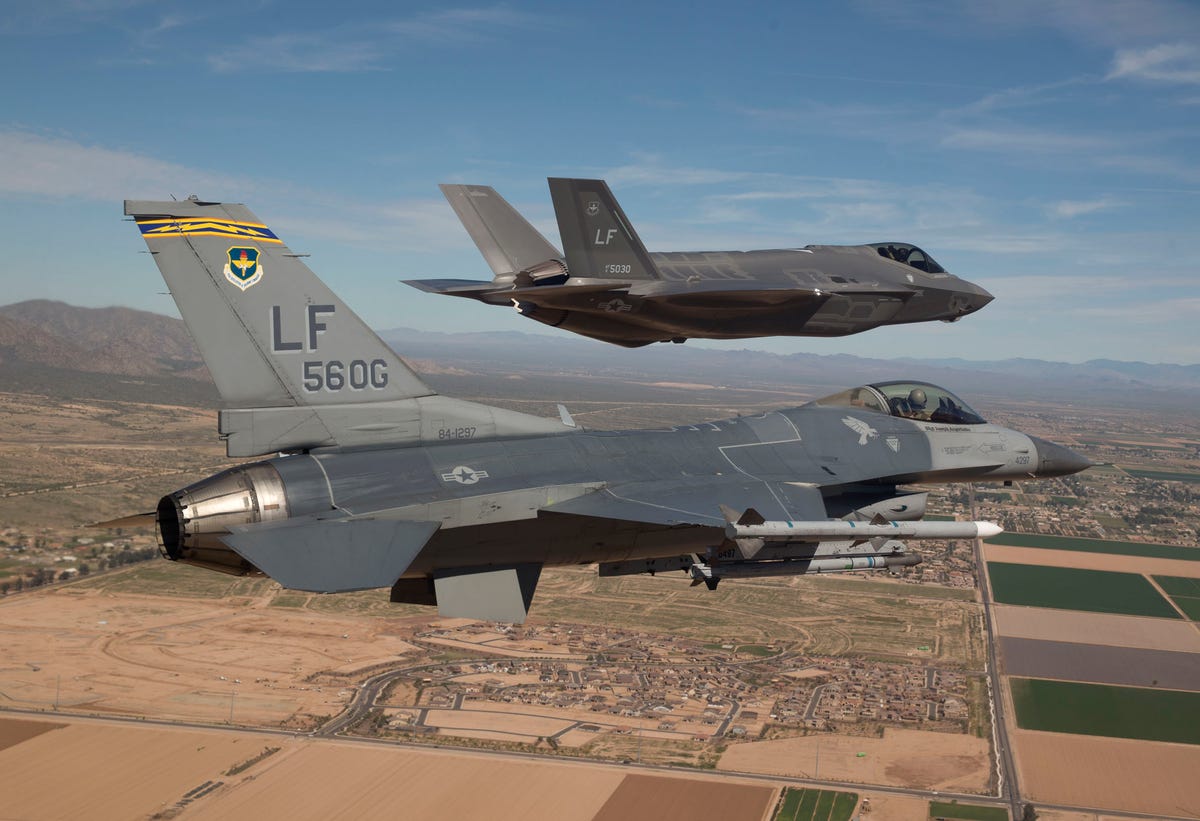 during-2014-the-long-delayed-f-35-next-generation-fighter-was-moved-to-its-new-home-at-luke-air-force-base-in-arizona-here-is-one-f-35-being-escorted-by-an-f-16.jpg