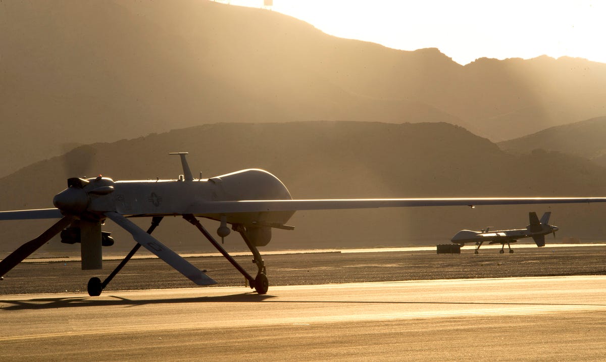 drone-operators-were-also-constantly-called-upon-throughout-2014-an-mq-1b-predator-left-and-an-mq-9-reaper-taxi-to-the-runway-in-preparation-for-takeoff-at-creech-air-force-base-in-nevada.jpg