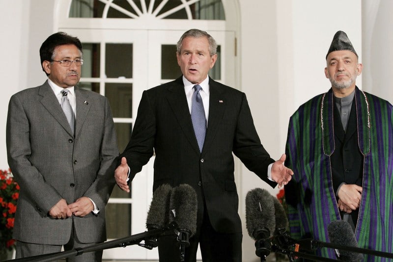 President George W. Bush deliver remarks while flanked by Afghanistan President Hamid Karzai and Pakistani President Pervez Musharraf in the Rose Garden at the White House September 27, 2006 in Washington, DC.