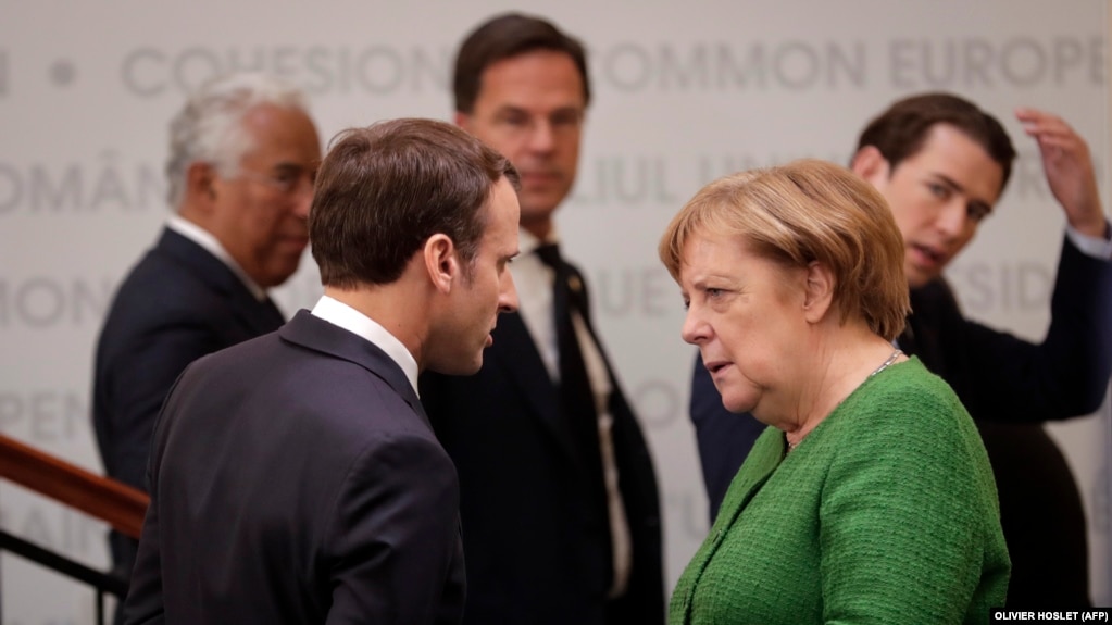 French President Emmanuel Macron (left) and German Chancellor Angela Merkel in Sibiu, Romania, on May 9