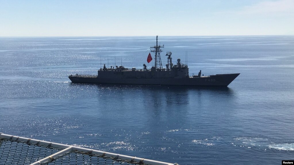 FILE - Turkish Navy frigate Gaziantep escorts drilling vessel Fatih off the Mediterranean resort city of Antalya, Turkey, Oct. 30, 2018.