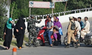Indian government forces stop Kashmiri civilians at a checkpoint in Srinagar, September 2019