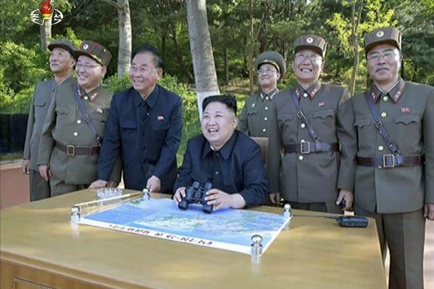 FILE PHOTO -- This image made from video of a news bulletin aired by North Korea's KRT on May 22, 2017, shows Kim Jong Un watching the test launch of what was said to be the Pukguksong-2 missile at an undisclosed location in North Korea in 2017. (KRT via AP Video)