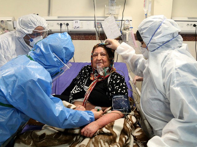 Medics treat a patient infected with the new coronavirus, at a hospital in Tehran, Iran, Sunday, March 8, 2020. With the approaching Persian New Year, known as Nowruz, officials kept up pressure on people not to travel and to stay home. Health Ministry spokesman Kianoush Jahanpour, who gave Iran's new …